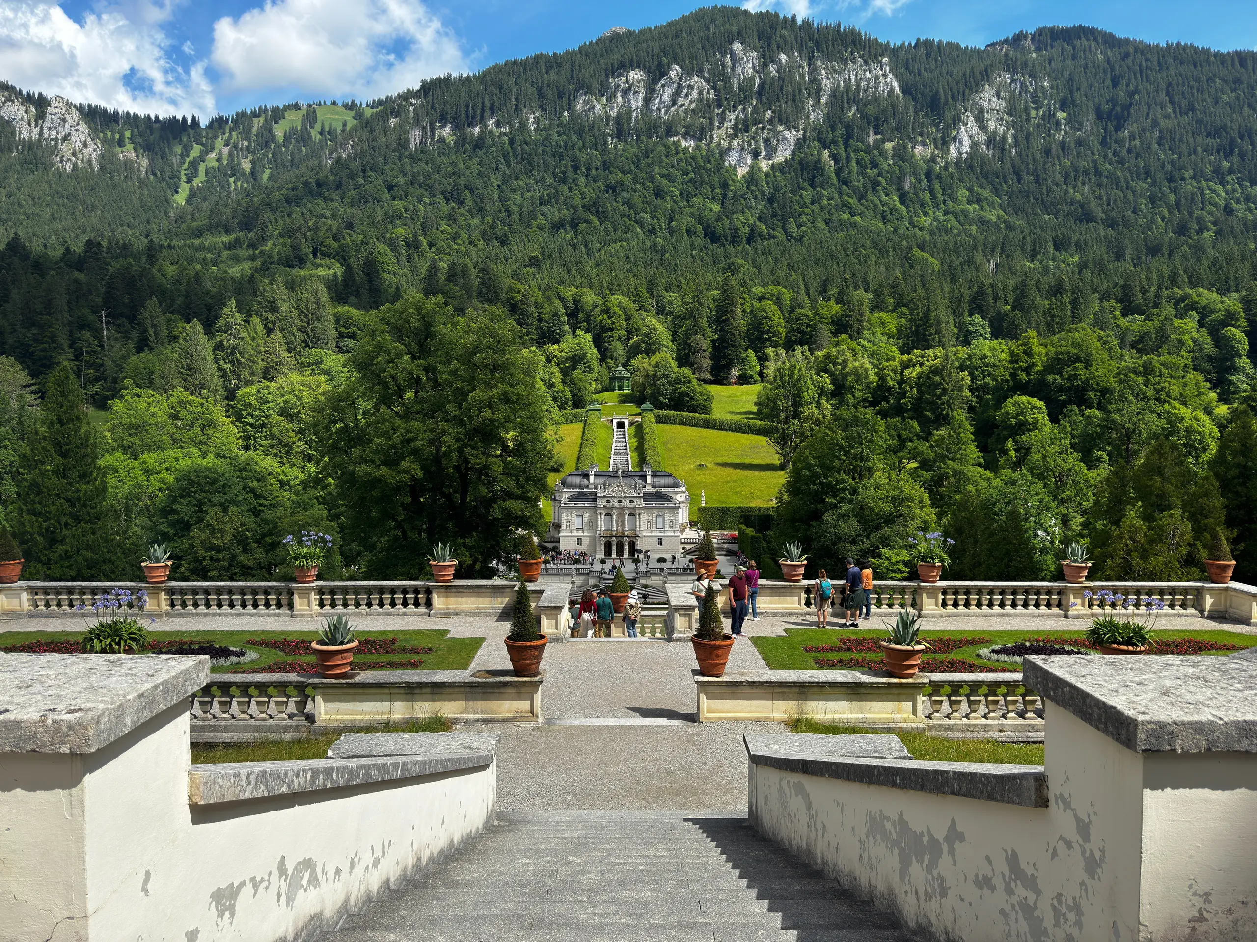 The terrace of Linderhof Palace in Bavaria with the Alps rising in the background.